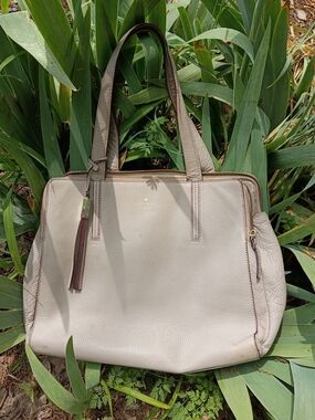 kate spade Cream Pebble Leather Tote with Tassel And Storybook Lining